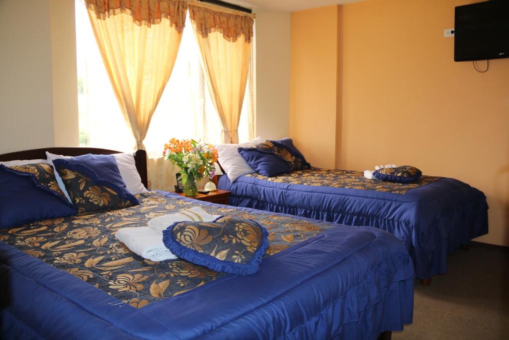 Postel nebo postele na pokoji v ubytování Hotel Residencial El Viajero