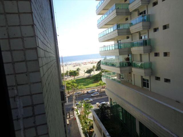 a view of a building from a window of a building at Apartamento Gonzaga in Santos