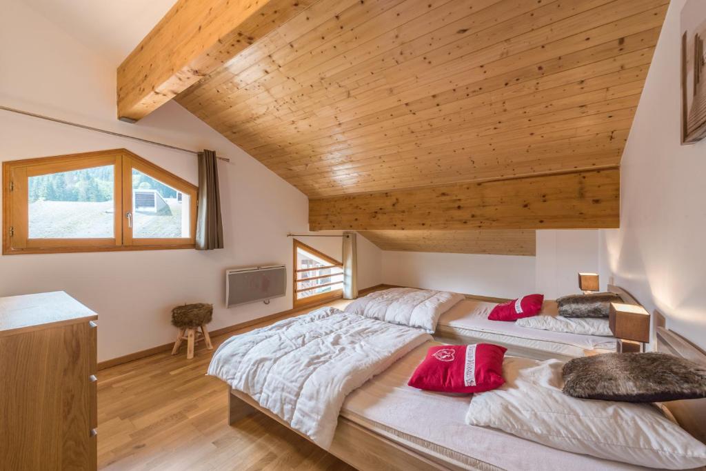 Postel nebo postele na pokoji v ubytování L'Eden Ski aux Pieds