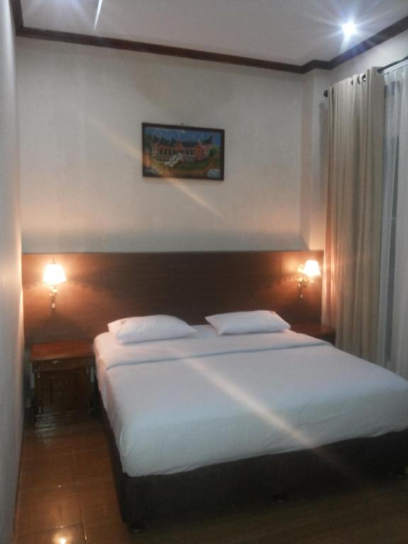 Postel nebo postele na pokoji v ubytování RF Hotel