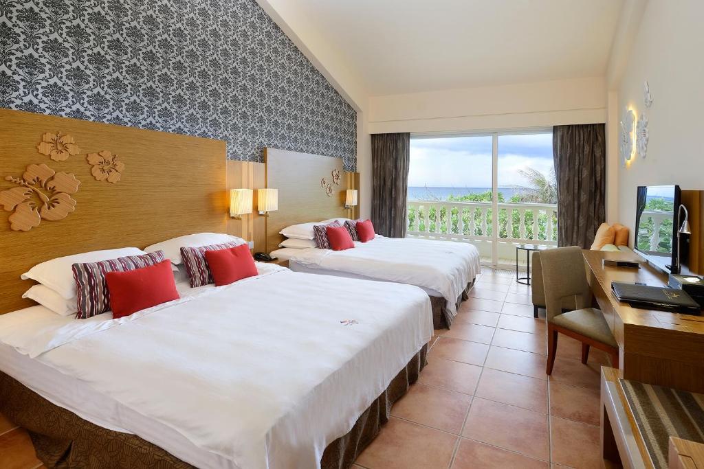 Letto o letti in una camera di Chateau Beach Resort Kenting