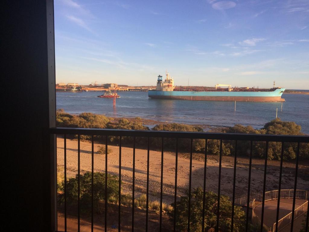 a large ship in the water from a balcony at Best View in Port Hedland in Port Hedland