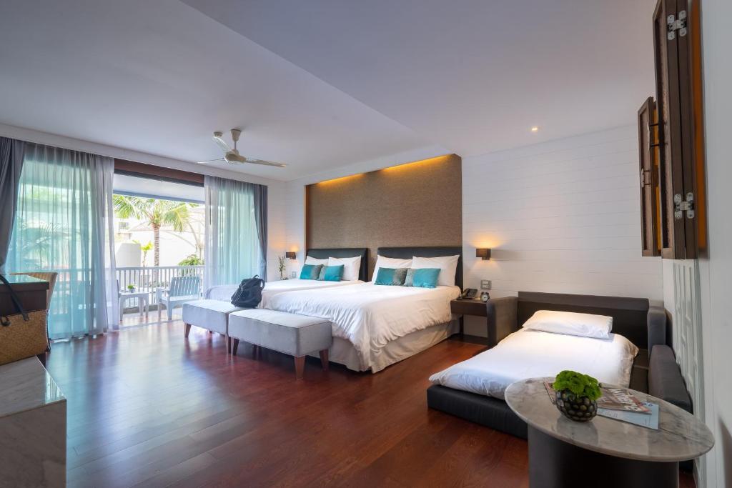 Postel nebo postele na pokoji v ubytování Loligo Resort Hua Hin