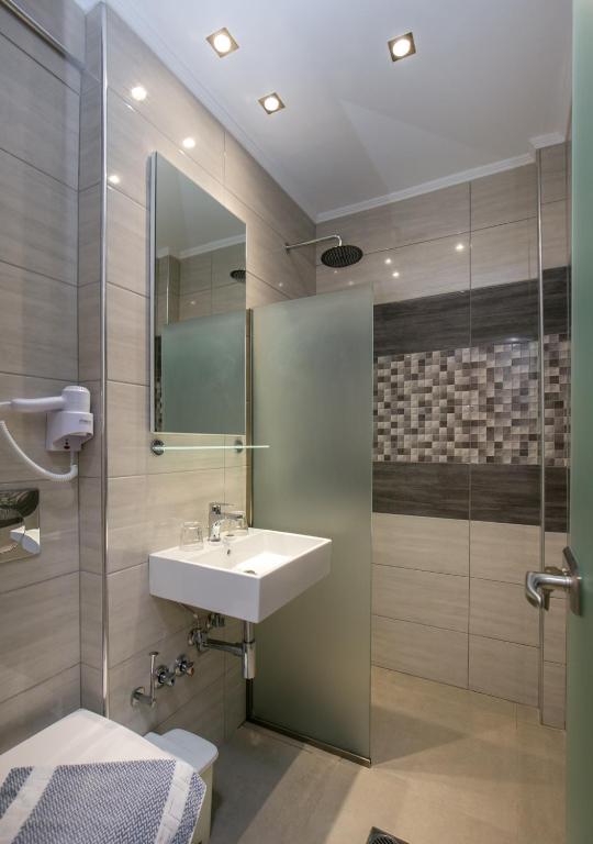 Koupelna v ubytování Astris Sun Hotel