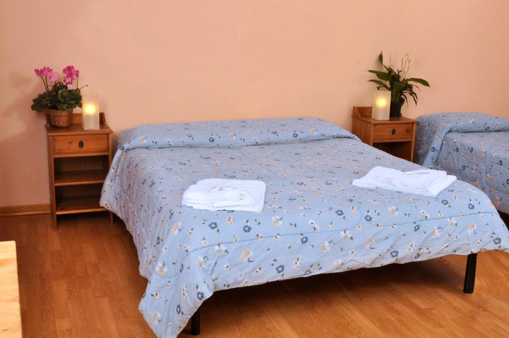 Łóżko lub łóżka w pokoju w obiekcie Gialel Guesthouse