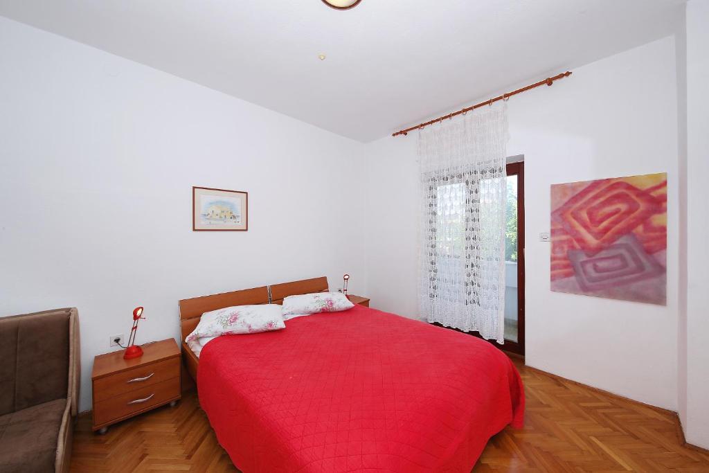 Postel nebo postele na pokoji v ubytování Punta Preko Apartments