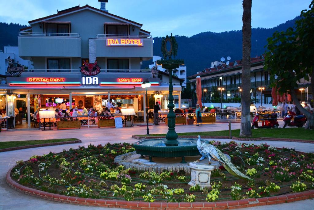 a fountain in the middle of a town square at Ida Hotel in Marmaris