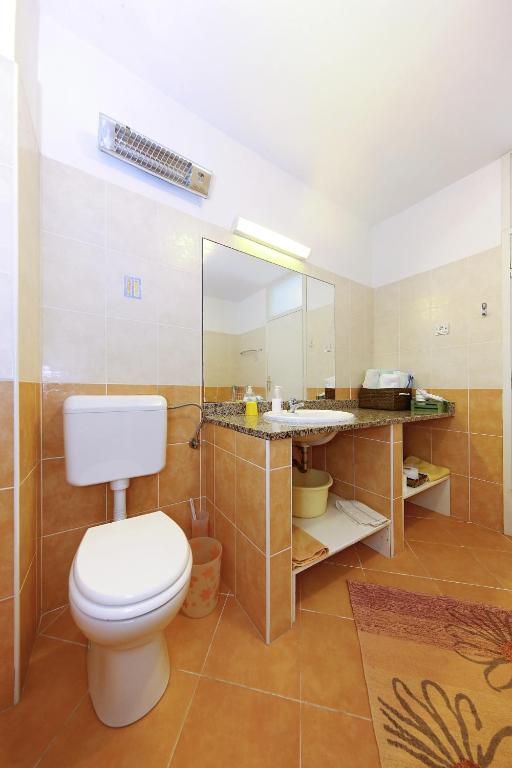 Koupelna v ubytování Punta Preko Apartments