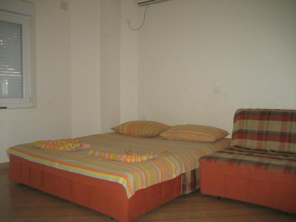 Postel nebo postele na pokoji v ubytování Guest House Vila Mimoza