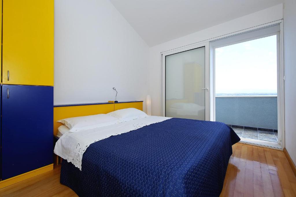 Postel nebo postele na pokoji v ubytování Punta Preko Apartments