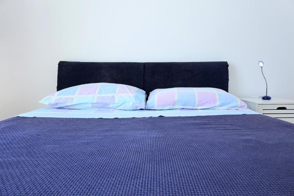 Postel nebo postele na pokoji v ubytování Punta Preko Apartments