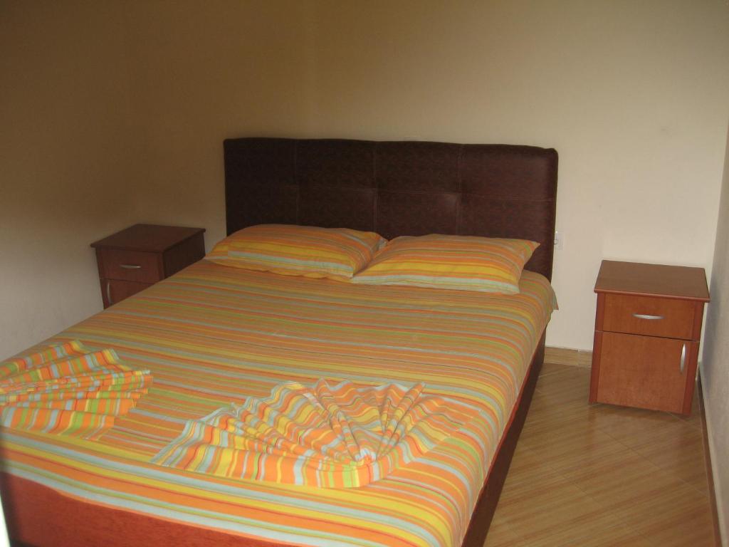Postel nebo postele na pokoji v ubytování Guest House Vila Mimoza
