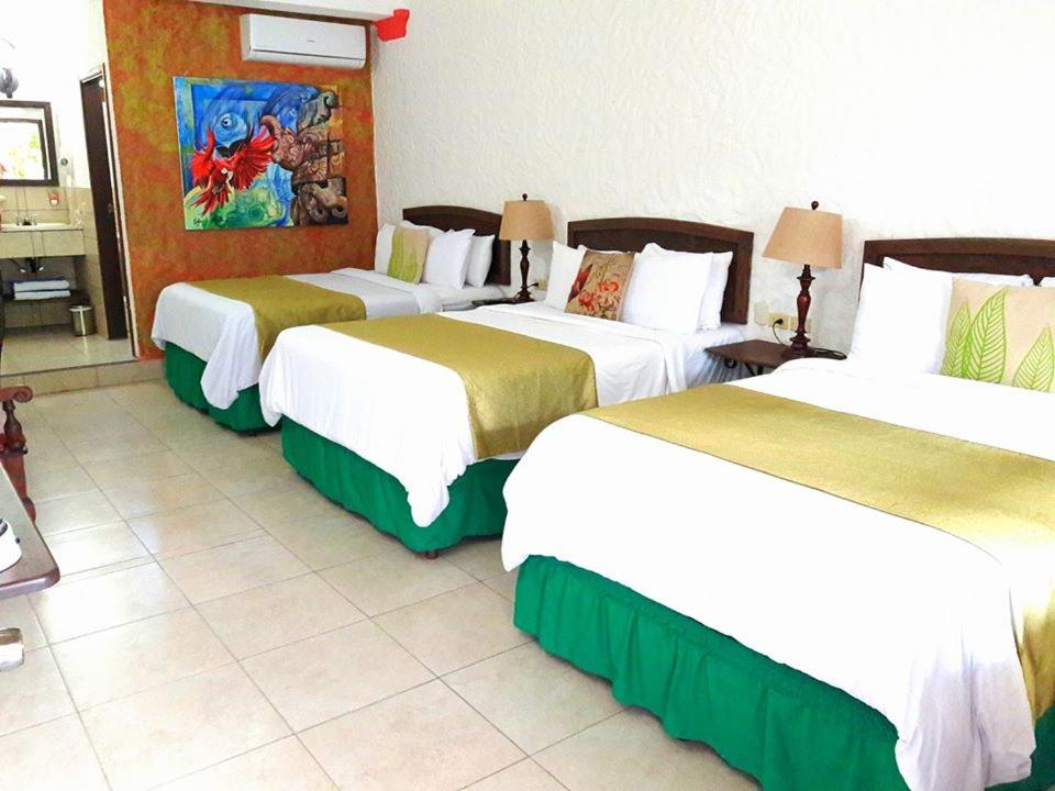 Postel nebo postele na pokoji v ubytování Hotel Ciudad Blanca