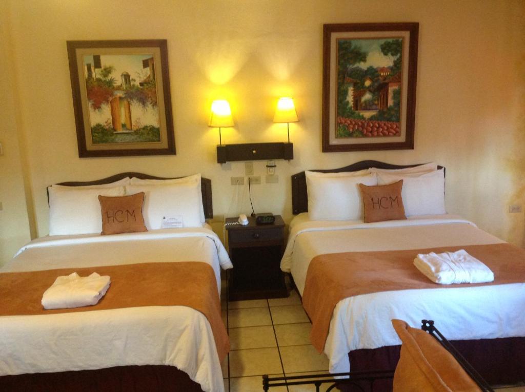 Postel nebo postele na pokoji v ubytování Hotel Camino Maya