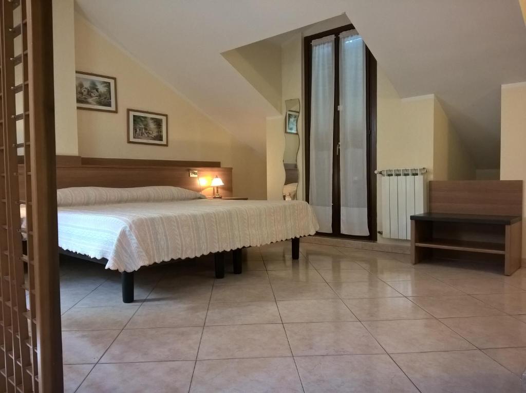 Postel nebo postele na pokoji v ubytování Hotel Rocco