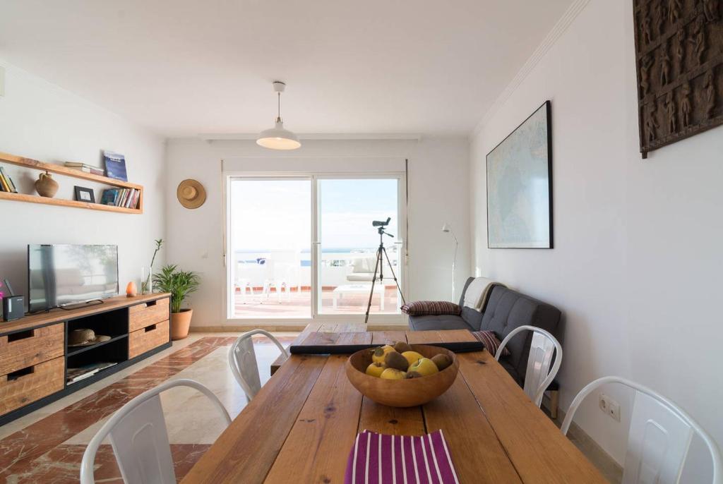 Televízia a/alebo spoločenská miestnosť v ubytovaní Apartamento Sietecolores Sea View