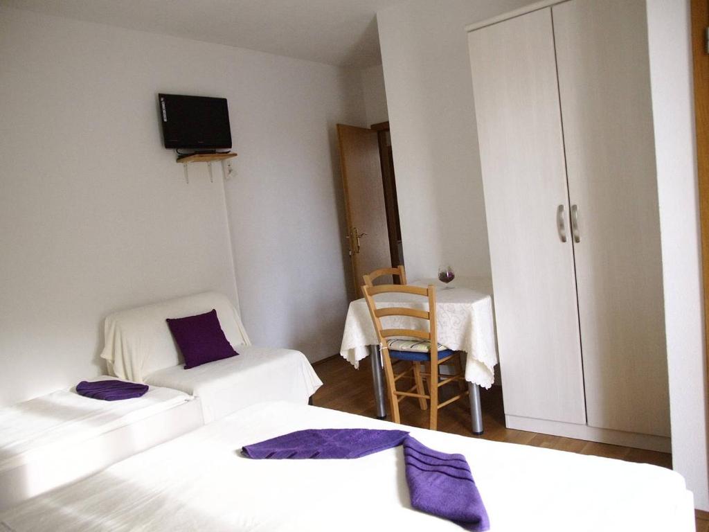 Postel nebo postele na pokoji v ubytování Guesthouse Marinovic