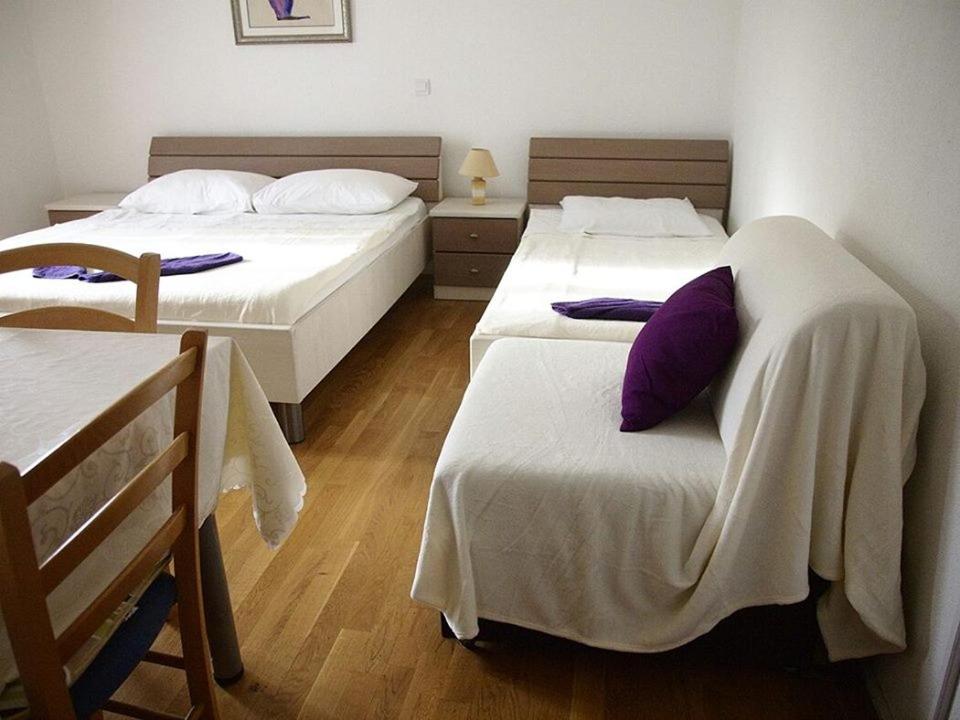 Postel nebo postele na pokoji v ubytování Guesthouse Marinovic