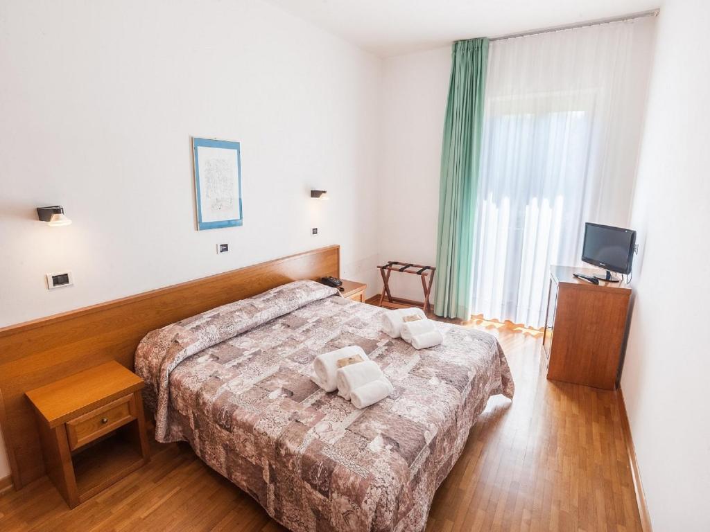 Postel nebo postele na pokoji v ubytování Hotel Palazzuolo