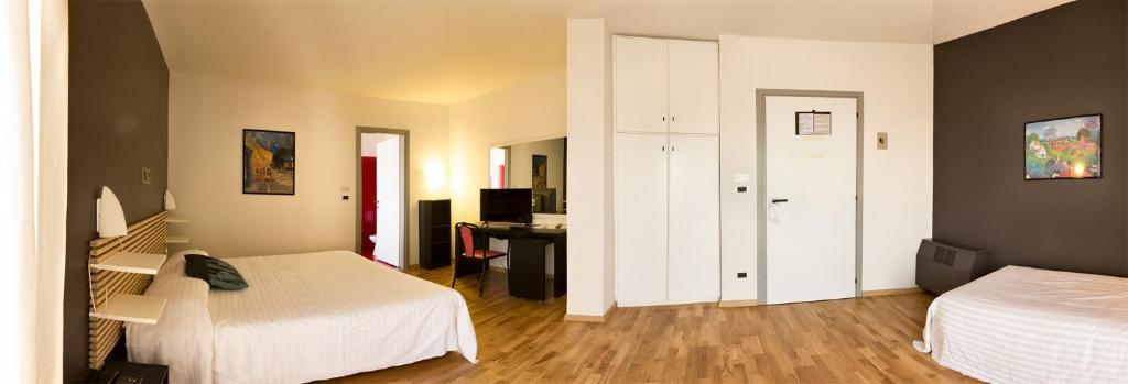 Postel nebo postele na pokoji v ubytování Hotel Quadrifoglio