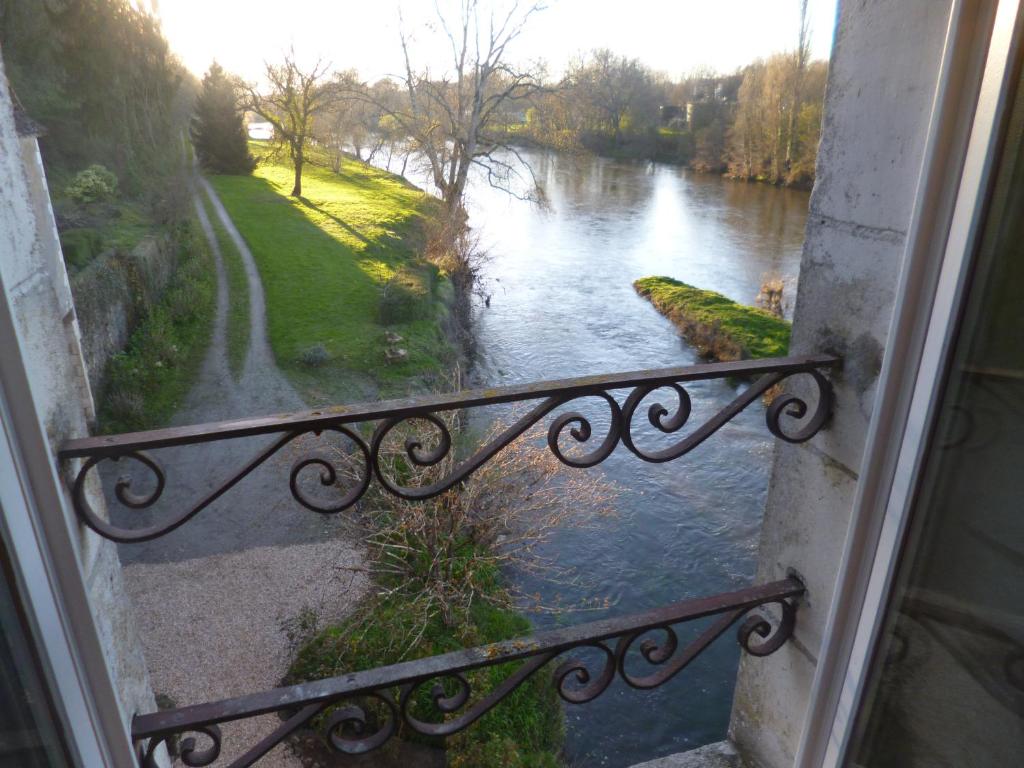 a view of a river from a window at Le Moulin de Cors in Oulches