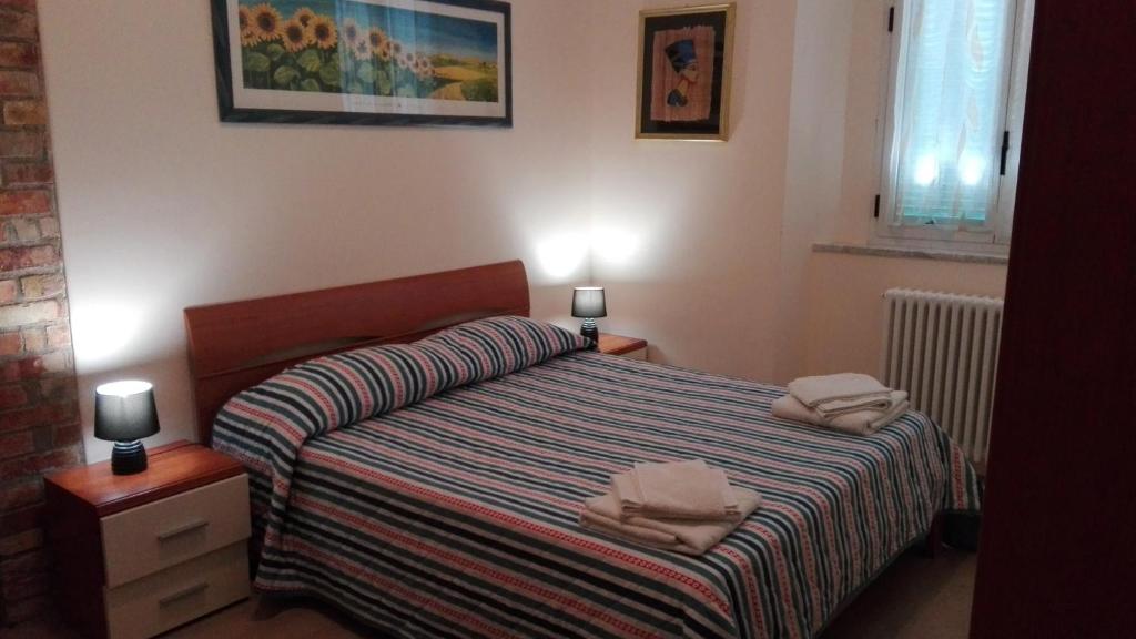 Postel nebo postele na pokoji v ubytování Le Due Nicchie