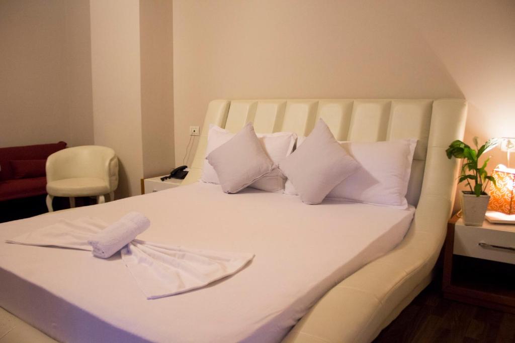 Postel nebo postele na pokoji v ubytování Hotel Bylis