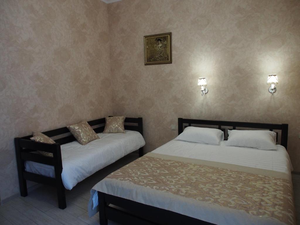 Postel nebo postele na pokoji v ubytování Kolmark Residence
