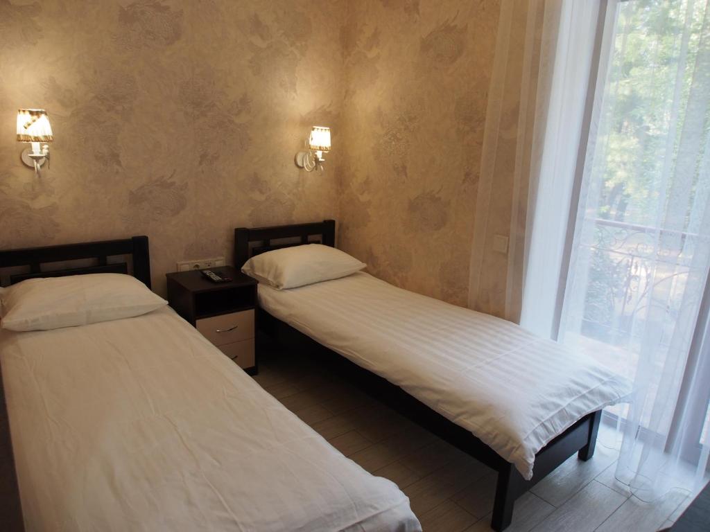 Postel nebo postele na pokoji v ubytování Kolmark Residence