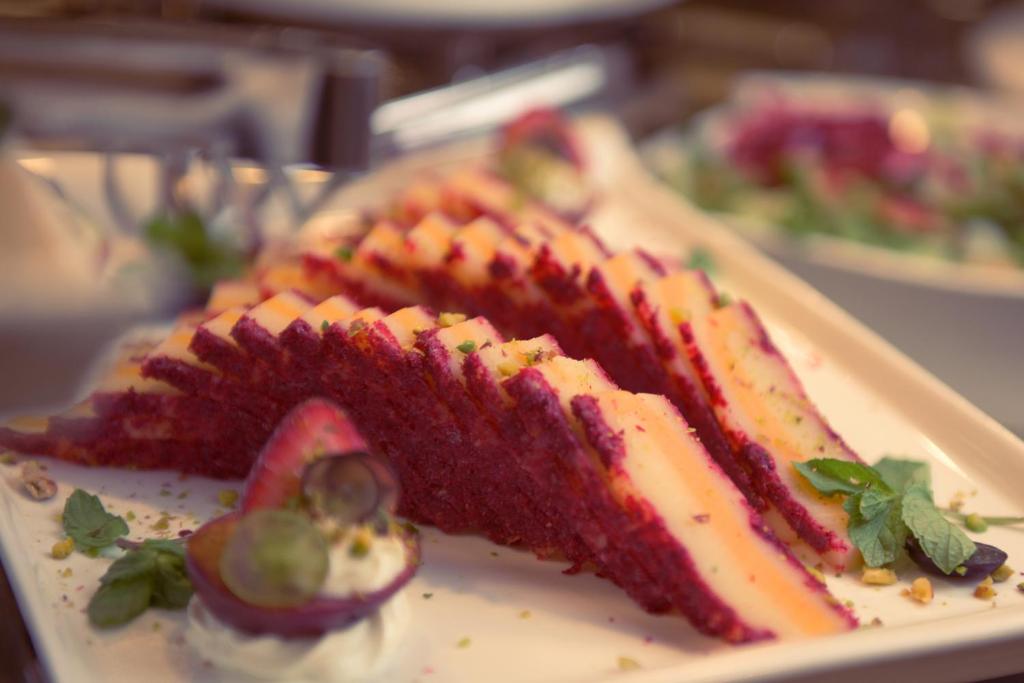a piece of red velvet cake on a plate at Saja Al Madinah in Al Madinah