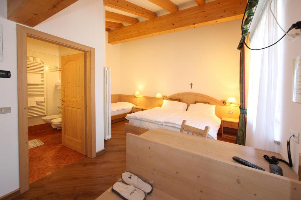 Postel nebo postele na pokoji v ubytování Hotel El Pilon