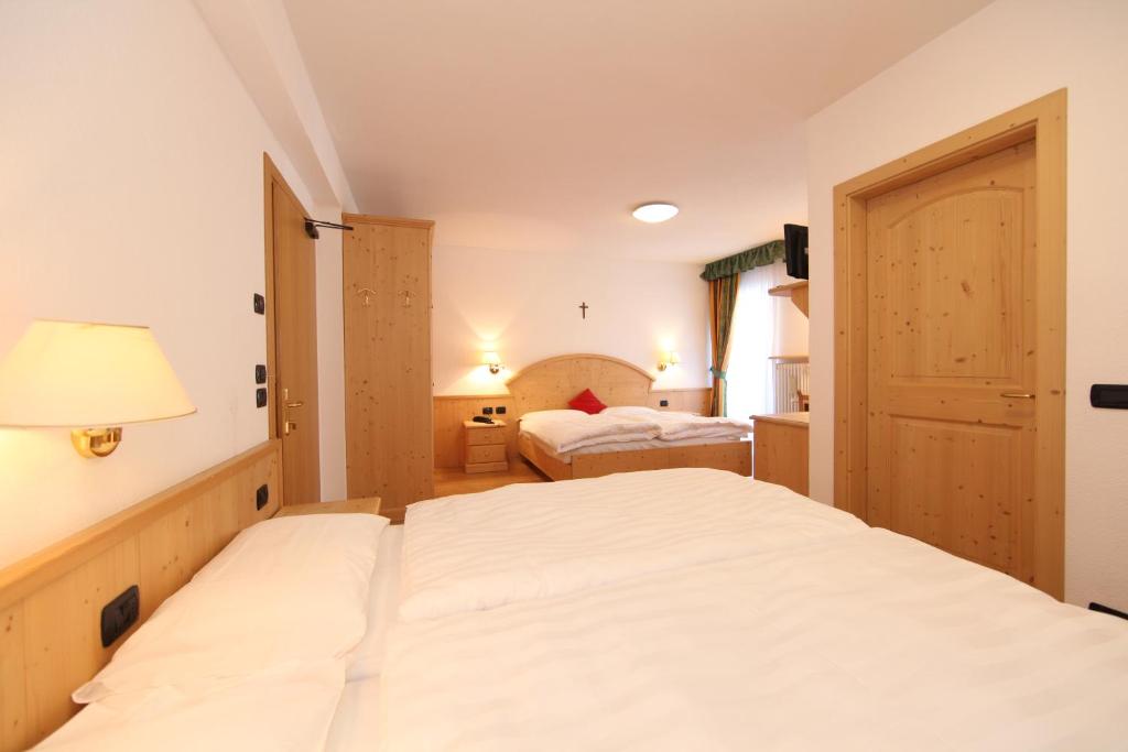 Postel nebo postele na pokoji v ubytování Hotel El Pilon