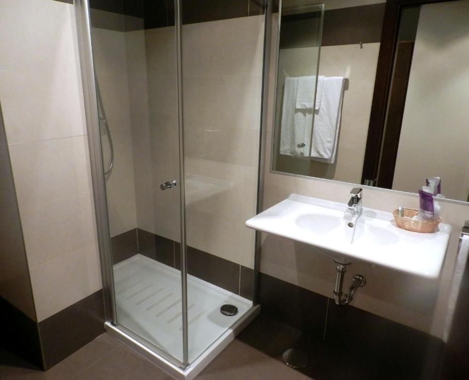 a bathroom with a shower and a sink at Hotel Río Hortega in Valladolid