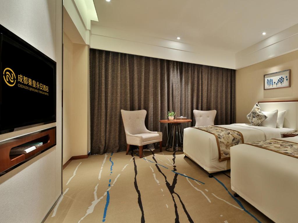 TV a/nebo společenská místnost v ubytování Qin Huang Yong An Hotel