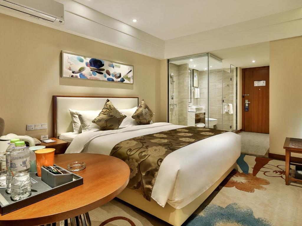 Postel nebo postele na pokoji v ubytování Qin Huang Yong An Hotel