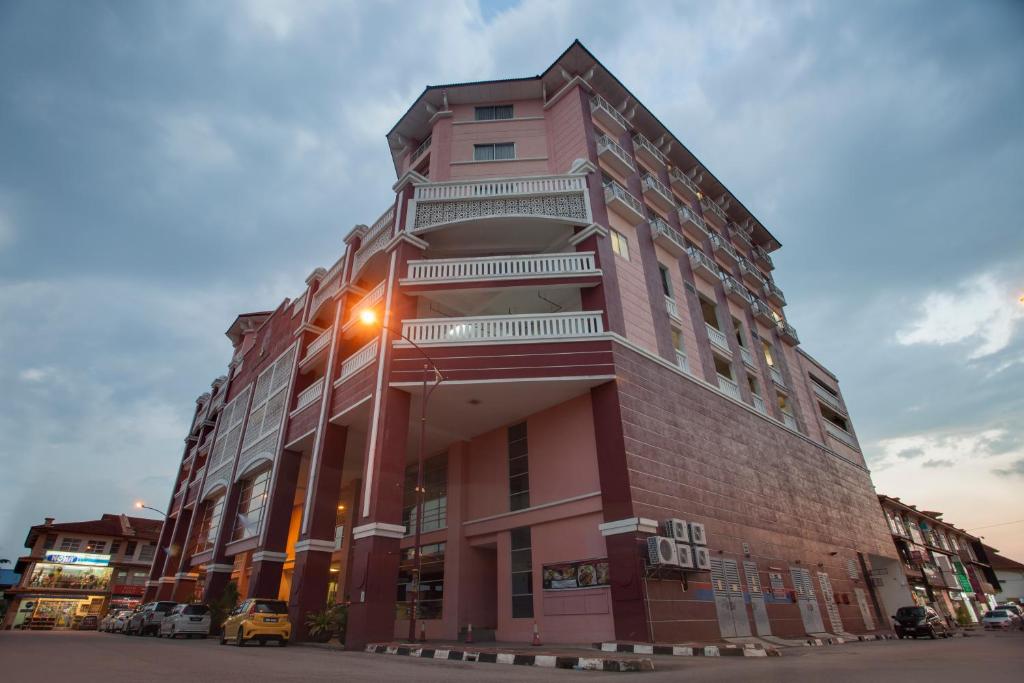 a large building with a light on the side of it at Hotel Seri Malaysia Kepala Batas in Kepala Batas