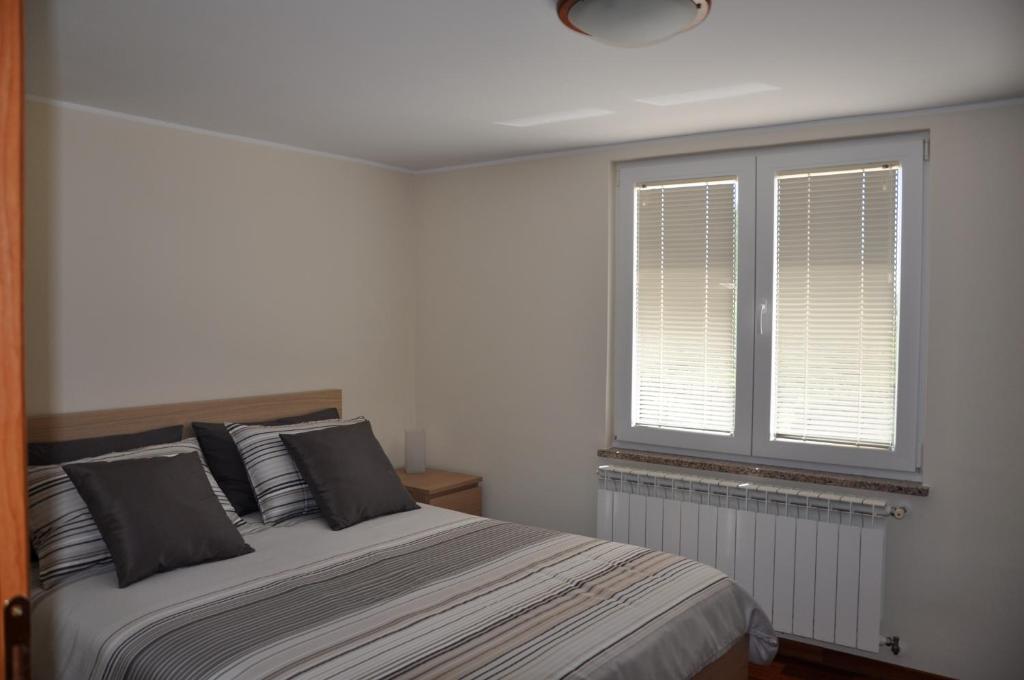 Postel nebo postele na pokoji v ubytování Villa Ulivo Apartments