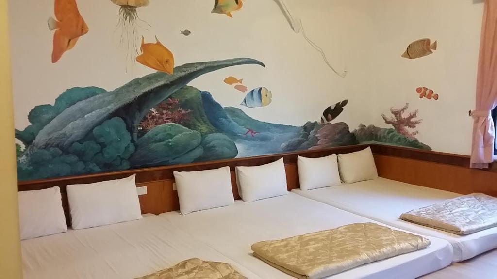 Postel nebo postele na pokoji v ubytování Hua Hung Guest House