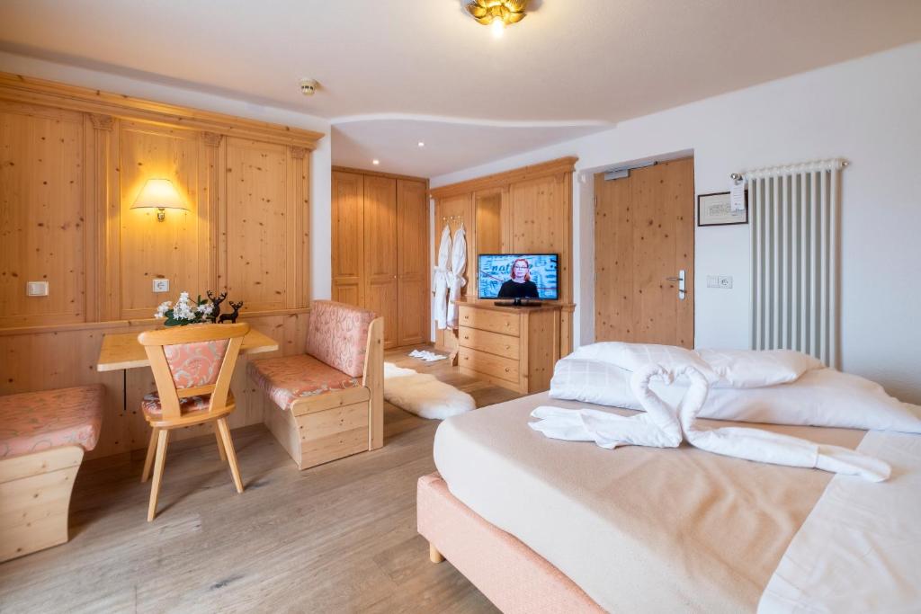 Postel nebo postele na pokoji v ubytování Hotel Serena