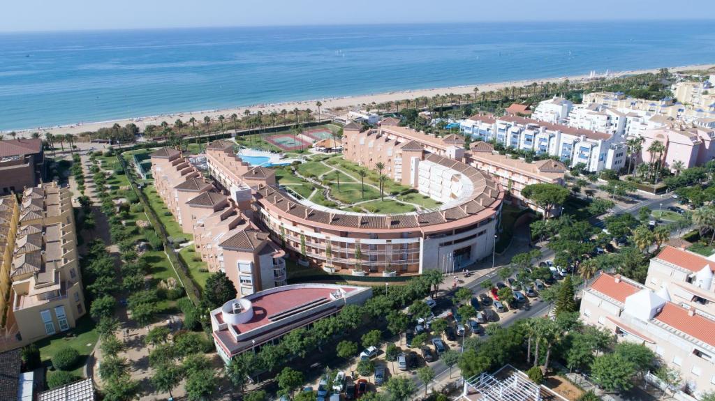 an aerial view of a city with the ocean at Apartamentos Las Americas in Islantilla