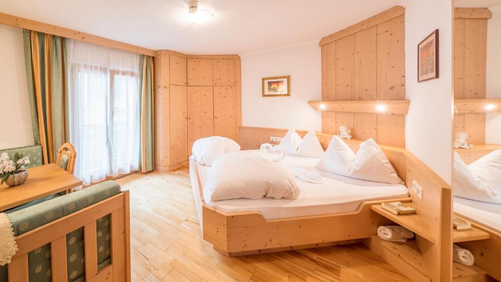 Postel nebo postele na pokoji v ubytování Hotel Serena