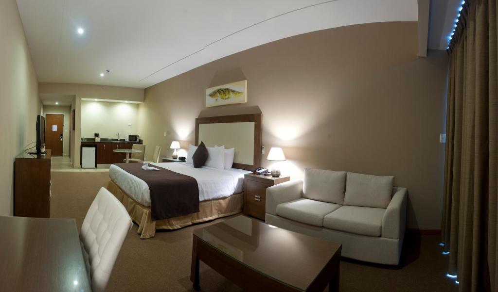 Säng eller sängar i ett rum på Central Park Hotel & Casino