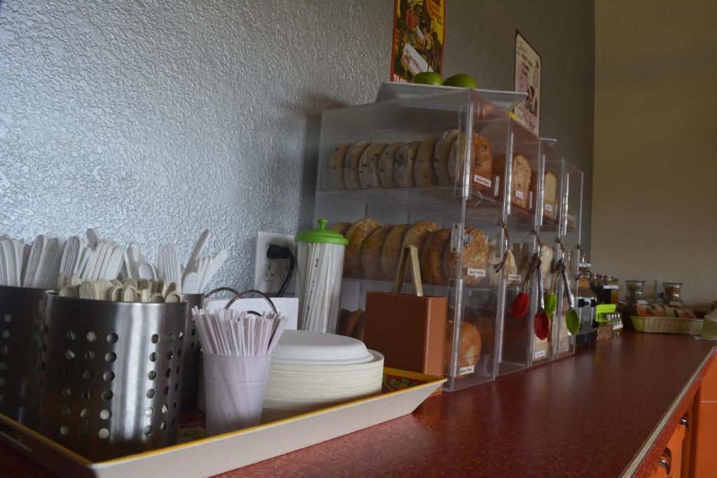 a counter with plates and utensils in a kitchen at Retro Inn at Mesa Verde in Cortez