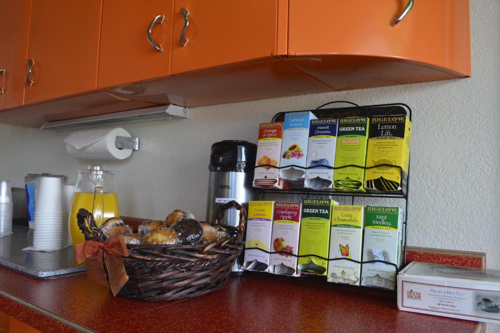 a counter top with a basket of food on it at Retro Inn at Mesa Verde in Cortez