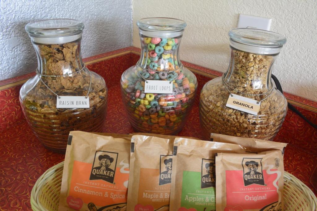 three glass vases filled with food and some bags of seeds at Retro Inn at Mesa Verde in Cortez