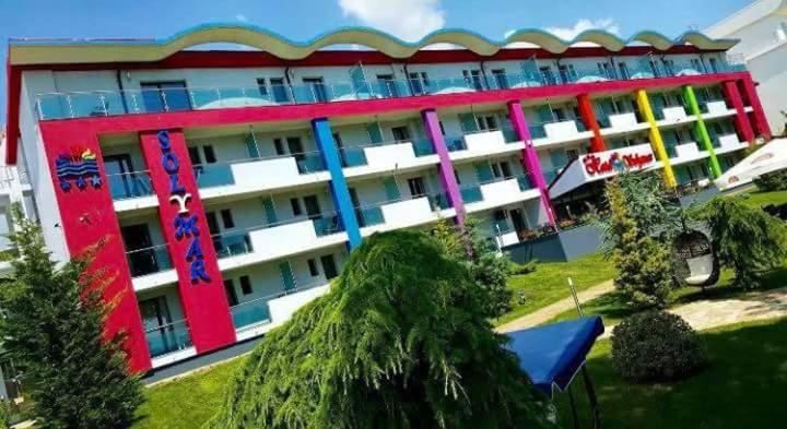 a large building with colorful paint on it at Hotel Solymar in Mangalia