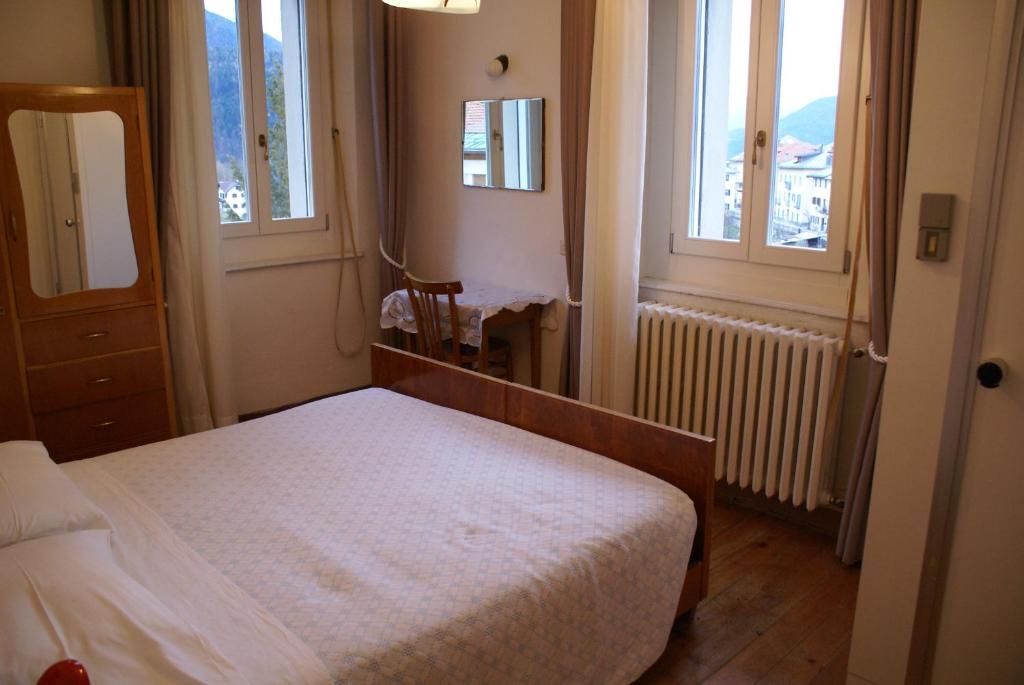 Posteľ alebo postele v izbe v ubytovaní Albergo Trieste