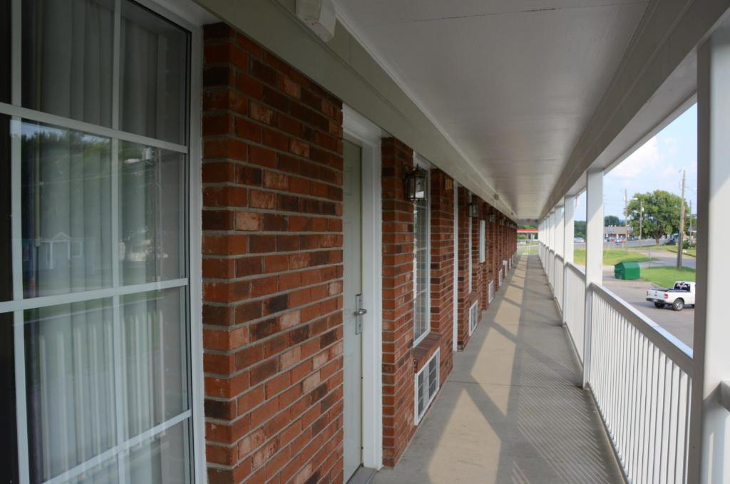 an empty hallway of a brick building at Richland Inn - Lewisburg in Lewisburg