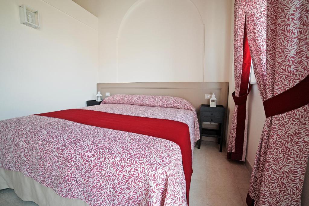 Postel nebo postele na pokoji v ubytování IL FILARO del Castello di San Basilio