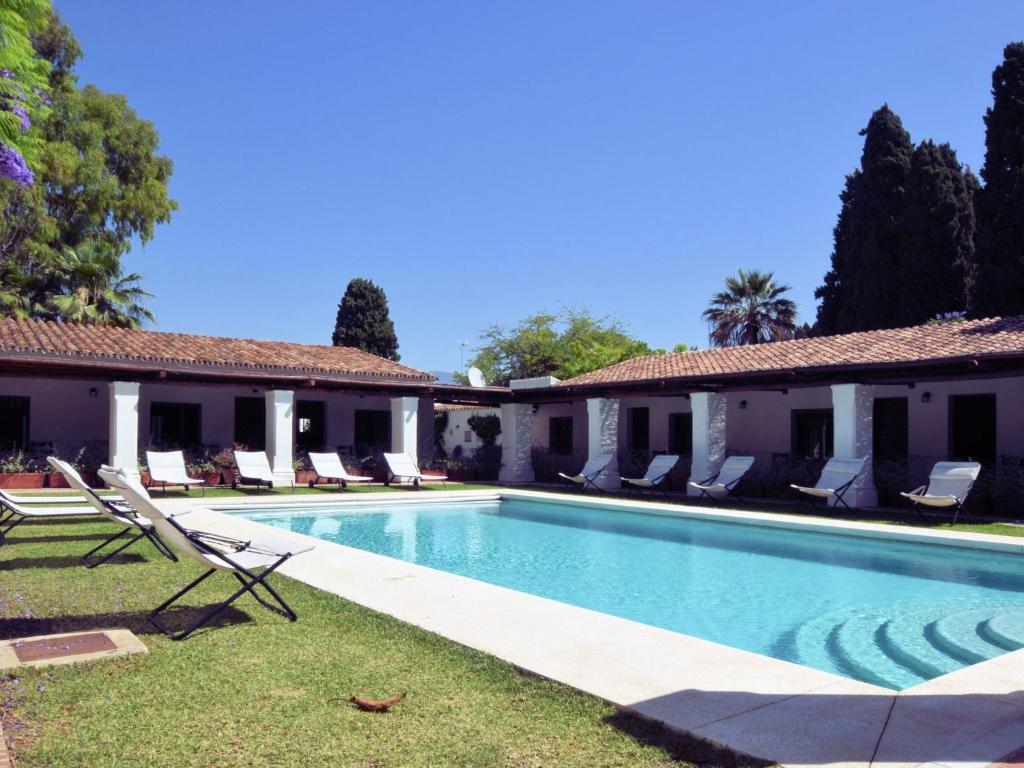 a swimming pool in the yard of a house at Luxurious Villa in Marbella with Swimming Pool in Marbella